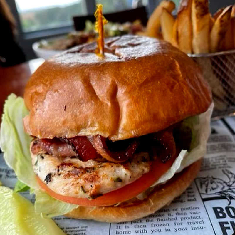 Sandtrap Bar and Grille |  Bacon Chicken Sandwich served with french fries